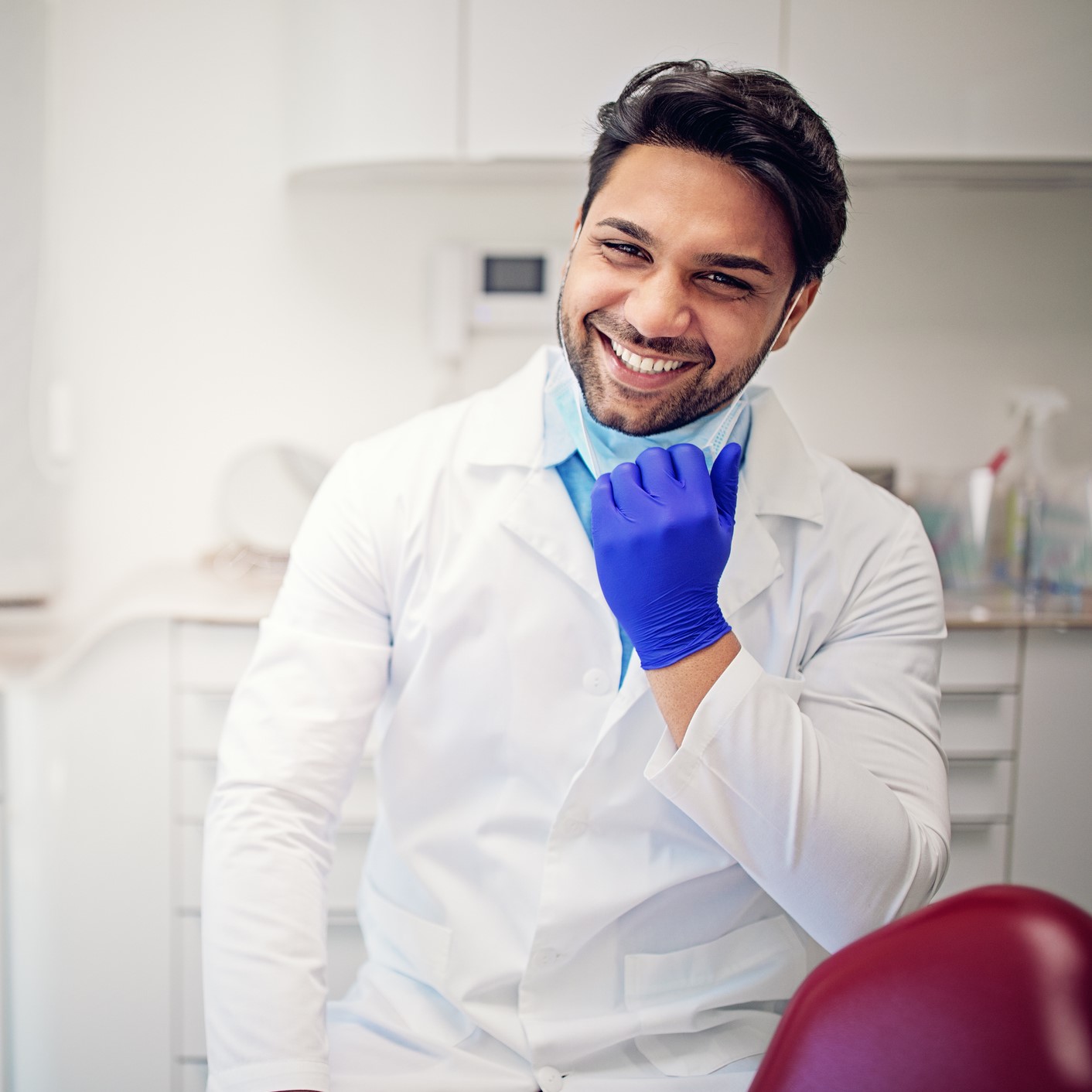 Portrait of dentist in his dentist office Oral Cancer Examination